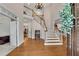 Grand foyer with staircase, chandelier, and hardwood floors makes a great first impression at 1548 Valley Reserve Nw Ct, Kennesaw, GA 30152