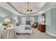 Large primary bedroom boasting a tray ceiling, ceiling fan, and large windows at 1548 Valley Reserve Nw Ct, Kennesaw, GA 30152