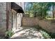 Enclosed brick patio with a door leading to the interior of the home at 1548 Valley Reserve Nw Ct, Kennesaw, GA 30152