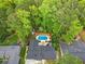 Stunning aerial view of a private pool surrounded by lush greenery at 2895 Dunnington Cir, Atlanta, GA 30341