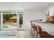 Bar area open to outdoor pool, featuring seating and access to the backyard at 2895 Dunnington Cir, Atlanta, GA 30341