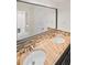 Bathroom featuring a double sink vanity with stylish countertop and tiled backsplash at 2895 Dunnington Cir, Atlanta, GA 30341