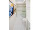 Bathroom featuring a tub with glass doors, along with simple decorations and white tile at 2895 Dunnington Cir, Atlanta, GA 30341
