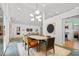 Bright dining room featuring modern lighting and view of the kitchen at 2895 Dunnington Cir, Atlanta, GA 30341