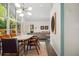 Contemporary dining area adjacent to the living room with natural light at 2895 Dunnington Cir, Atlanta, GA 30341