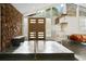 The home's entry features a stone accent wall, sleek flooring, and custom shelving to maximize space at 2895 Dunnington Cir, Atlanta, GA 30341