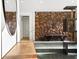 The foyer features a stone wall, tile flooring, and wood accents, creating a warm and inviting entrance at 2895 Dunnington Cir, Atlanta, GA 30341