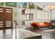 The foyer showcases sleek flooring, a decorative shelving unit, and a warm-toned couch, creating an inviting atmosphere at 2895 Dunnington Cir, Atlanta, GA 30341