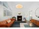 A cozy living room with a fireplace, unique lighting, and comfortable seating, perfect for relaxation at 2895 Dunnington Cir, Atlanta, GA 30341