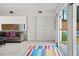 Bright living room with built-in shelving, comfortable seating, and sliding door access at 2895 Dunnington Cir, Atlanta, GA 30341