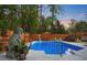 Beautiful in-ground pool surrounded by a wood fence and lush trees at 2895 Dunnington Cir, Atlanta, GA 30341