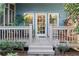Charming back porch with lush greenery, offering a serene outdoor space at 462 N Highland Ave, Atlanta, GA 30307