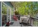 Landscaped backyard with a stone path, mature trees, and a patio area at 462 N Highland Ave, Atlanta, GA 30307