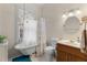 Bathroom features a clawfoot tub, floral curtains, and a vanity with a sink at 462 N Highland Ave, Atlanta, GA 30307
