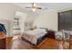 Bright bedroom featuring hardwood floors, large windows, and a ceiling fan at 462 N Highland Ave, Atlanta, GA 30307