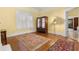 Bedroom with hardwood floors, antique armoire, and windows with wood shutters at 462 N Highland Ave, Atlanta, GA 30307