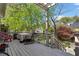 Outdoor deck features a pergola, dining table, rocking chair and staircase, perfect for relaxing and entertaining at 462 N Highland Ave, Atlanta, GA 30307