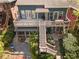Aerial view of this home with multiple decks, landscaped yard, and outdoor seating, ideal for outdoor living at 462 N Highland Ave, Atlanta, GA 30307