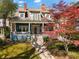 Charming home with a classic front porch, well-manicured lawn, and mature trees, offering great curb appeal at 462 N Highland Ave, Atlanta, GA 30307