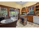 Eat-in kitchen featuring a butcher block island, tile floors, and access to screened-in porch at 462 N Highland Ave, Atlanta, GA 30307