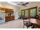 Spacious kitchen with a ceiling fan, appliances, dining area, and access to the back deck at 462 N Highland Ave, Atlanta, GA 30307