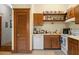 A modest kitchen with wooden cabinets, dishwasher, and a pantry cabinet at 462 N Highland Ave, Atlanta, GA 30307