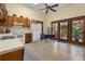 Bright kitchen with wooden cabinets, an eat-in area, and views of the yard at 462 N Highland Ave, Atlanta, GA 30307