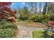 Well-maintained landscaping with vibrant foliage and a stone pathway, creating a picturesque and inviting outdoor area at 462 N Highland Ave, Atlanta, GA 30307