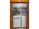 Handy laundry room with washer, dryer, and storage shelves at 462 N Highland Ave, Atlanta, GA 30307