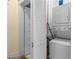 Laundry room features a stackable washer and dryer unit with white cabinets at 462 N Highland Ave, Atlanta, GA 30307