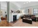 Cozy living room featuring a decorative fireplace, hardwood floors, and comfortable seating at 462 N Highland Ave, Atlanta, GA 30307
