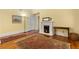 Cozy living room featuring a fireplace, decorative rug, hardwood floors, and vintage decor at 462 N Highland Ave, Atlanta, GA 30307