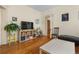 Cozy living room with hardwood floors and large television on shelving at 462 N Highland Ave, Atlanta, GA 30307