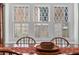 Close up of beautiful windows with diamond pattern panes, and wood frame at 462 N Highland Ave, Atlanta, GA 30307