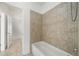 Bathroom featuring a shower over tub with tile surround at 52 Lath House Ln, Marietta, GA 30066