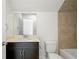 Traditional bathroom features a vanity with dark wood cabinets and beige countertop, with ceramic tile in shower at 52 Lath House Ln, Marietta, GA 30066