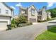 Exterior of townhomes features neutral siding, and well-maintained landscaping at 52 Lath House Ln, Marietta, GA 30066