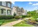Beautiful home with a well-manicured lawn and landscaping, providing great curb appeal at 52 Lath House Ln, Marietta, GA 30066
