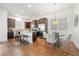 Modern kitchen featuring stainless steel appliances, granite countertops, and an island with seating at 52 Lath House Ln, Marietta, GA 30066