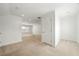 Open-concept living room with neutral carpeting at 52 Lath House Ln, Marietta, GA 30066