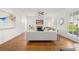 Bright living room featuring hardwood floors, a fireplace, and large windows at 52 Lath House Ln, Marietta, GA 30066