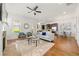Open-concept living room and kitchen with hardwood floors, fireplace, and modern decor at 52 Lath House Ln, Marietta, GA 30066