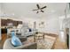 Open living area with a fireplace, kitchen, and hardwood floors, perfect for entertaining at 52 Lath House Ln, Marietta, GA 30066