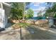 Spacious backyard featuring a concrete patio, grassy area, and wood fence at 5573 Singleton Rd, Norcross, GA 30093