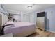 Relaxing bedroom featuring plush bedding, wood-look floors, and modern furnishings at 5573 Singleton Rd, Norcross, GA 30093