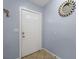 Bright entryway features tile flooring, neutral walls, and a stylish sunburst mirror at 5573 Singleton Rd, Norcross, GA 30093