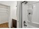 Bathroom with shower and tub combination, shelving, and a single sink vanity at 908 Hollyfax Cir, Sandy Springs, GA 30328