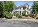 Multi-level home showcases well-maintained landscaping, complemented by lush greenery, enhancing curb appeal at 908 Hollyfax Cir, Sandy Springs, GA 30328