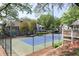 Community tennis courts, a recreational amenity surrounded by trees, enhancing leisure opportunities at 908 Hollyfax Cir, Sandy Springs, GA 30328