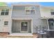 Townhome back exterior with sliding glass doors and an air conditioning unit at 1728 Devon Sw Dr, Atlanta, GA 30311